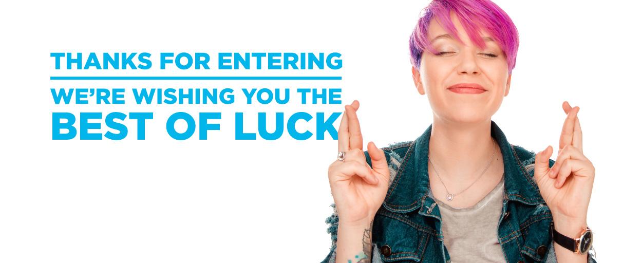 Woman with fingers crossed. Headline: Thanks for entering. We're wishing you the best of luck.
