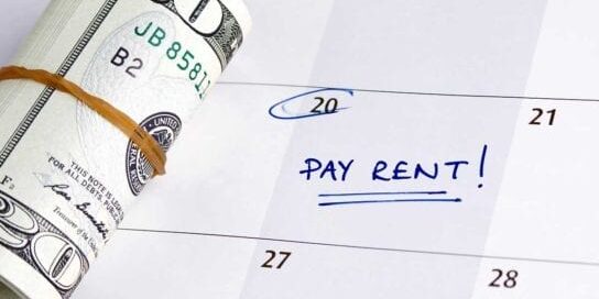 Avoid Eviction and Pay Rent On Time Money with Calendar Date Circled