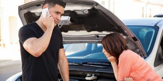 Pay for Car Repairs No Money Couple Broken Down with Car Hood Open