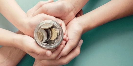 10 Payday Loan Benefits Helping Hands Holding Jar of Change Social Share